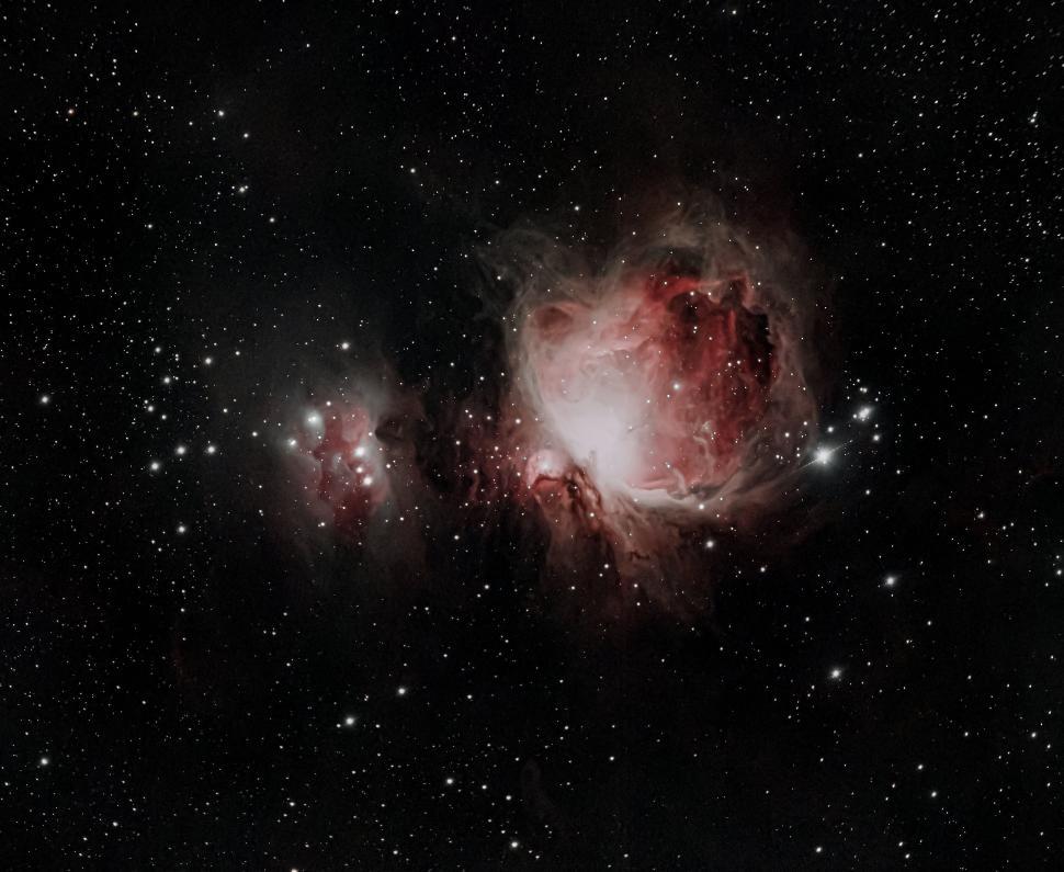 Free Image of Colorful nebula glowing with bright stars in space. 