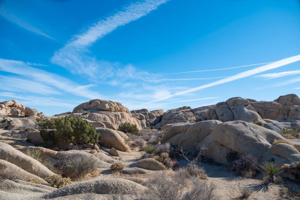 Free Image of Expansive rocky landscape under a bright blue sky. 