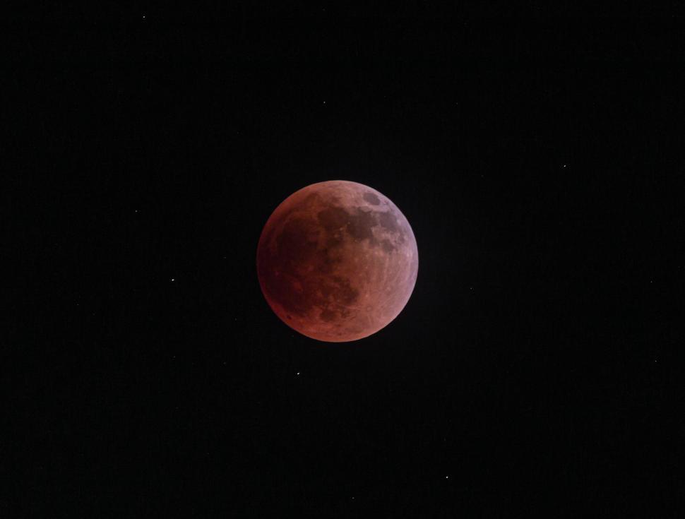 Free Image of Blood moon during a lunar eclipse in a starry sky 
