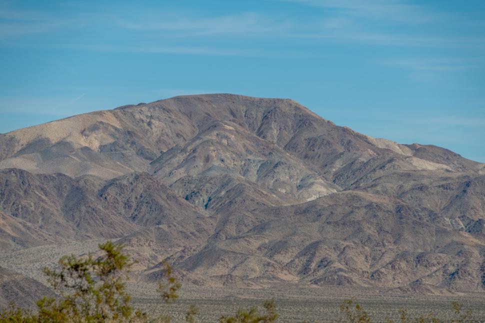 Free Image of Mountainous landscape under sunny clear blue sky 