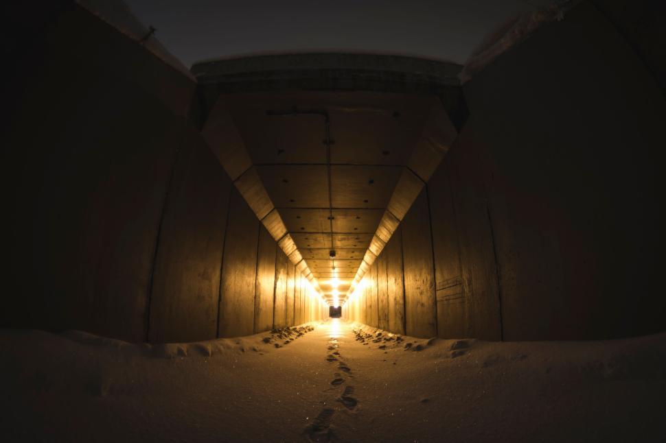 Free Image of Long Tunnel Illuminated by Warm Light Pathway Mystery 