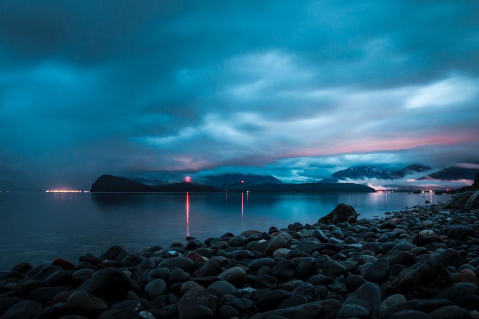 Free Image of A beautiful scenic view of a calm, misty coastal landscape. 