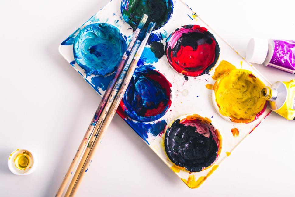 Free Image of Colorful artist palette with brushes and paints 
