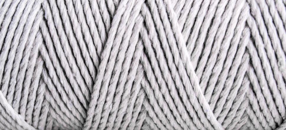 Free Image of Close-up of grey yarn showing intricate texture detail 