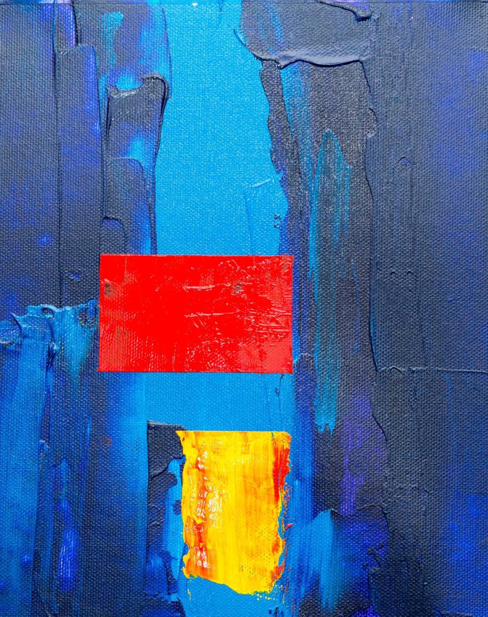 Free Image of Abstract painting with red and yellow blocks, blue background 