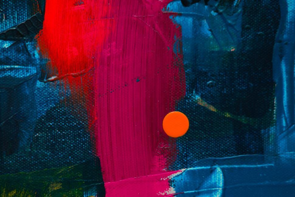 Free Image of Minimalistic abstract red splash on a dark blue background 