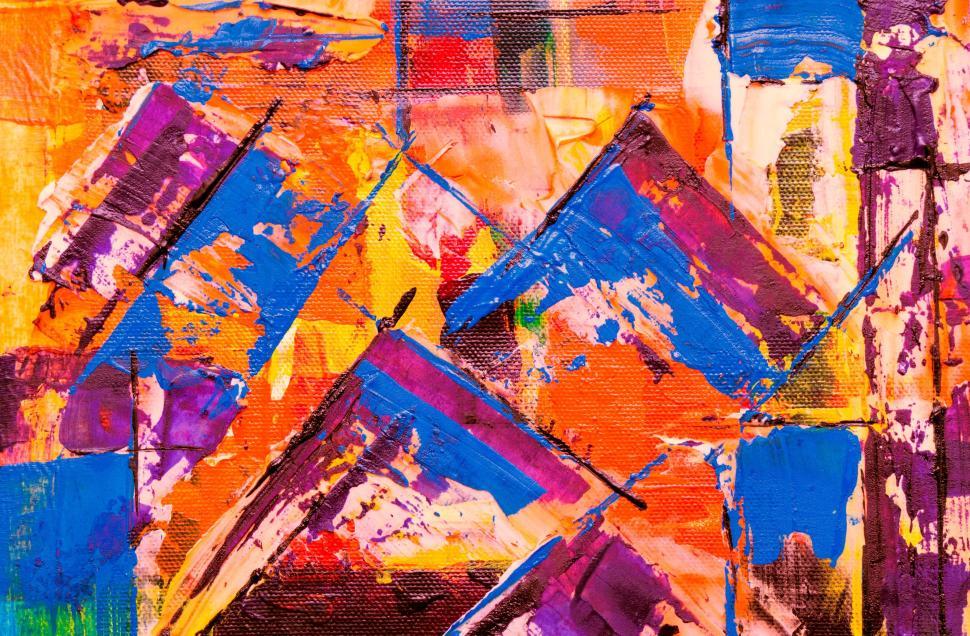 Free Image of Dynamic abstract shapes and colors on textured canvas 