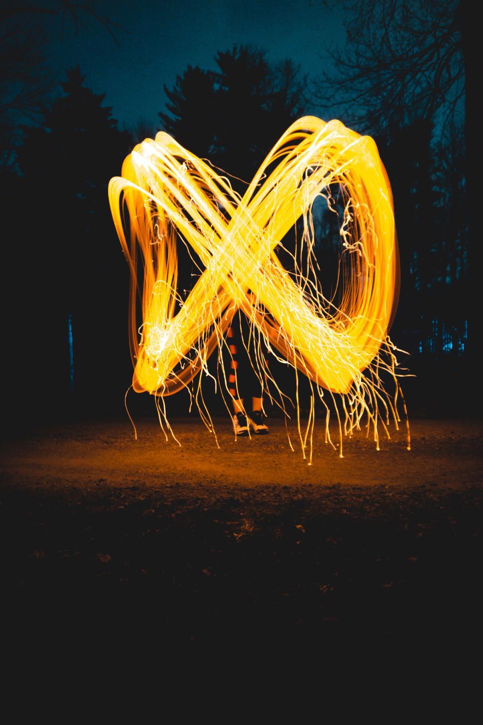 Free Image of Abstract long exposure of glowing light trails in loop 