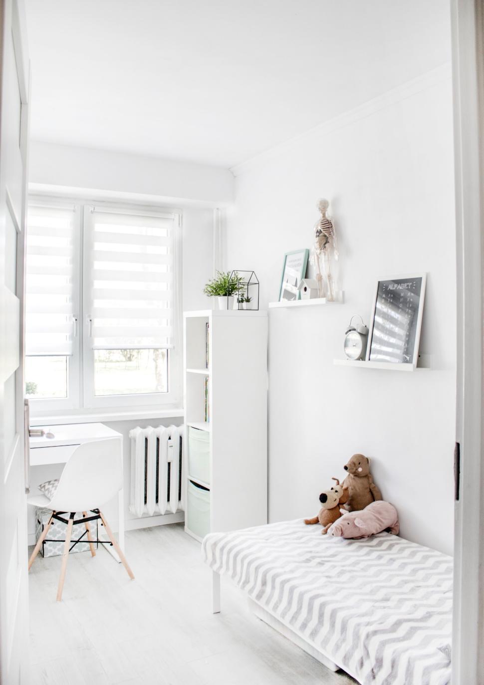 Free Image of Brightly lit minimalist white children s room interior. 