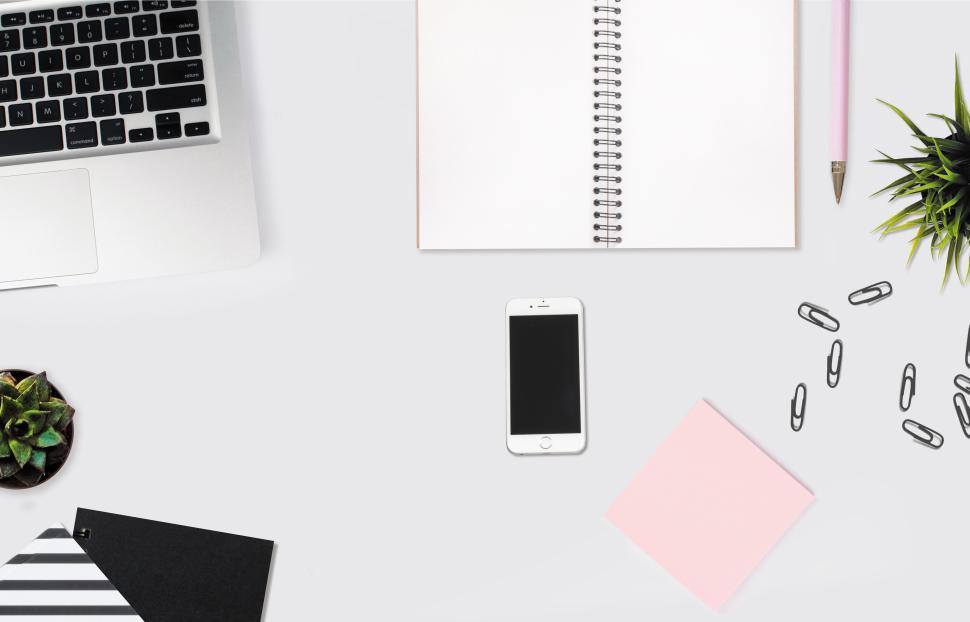 Free Image of Office desk essentials including notebook and phone 