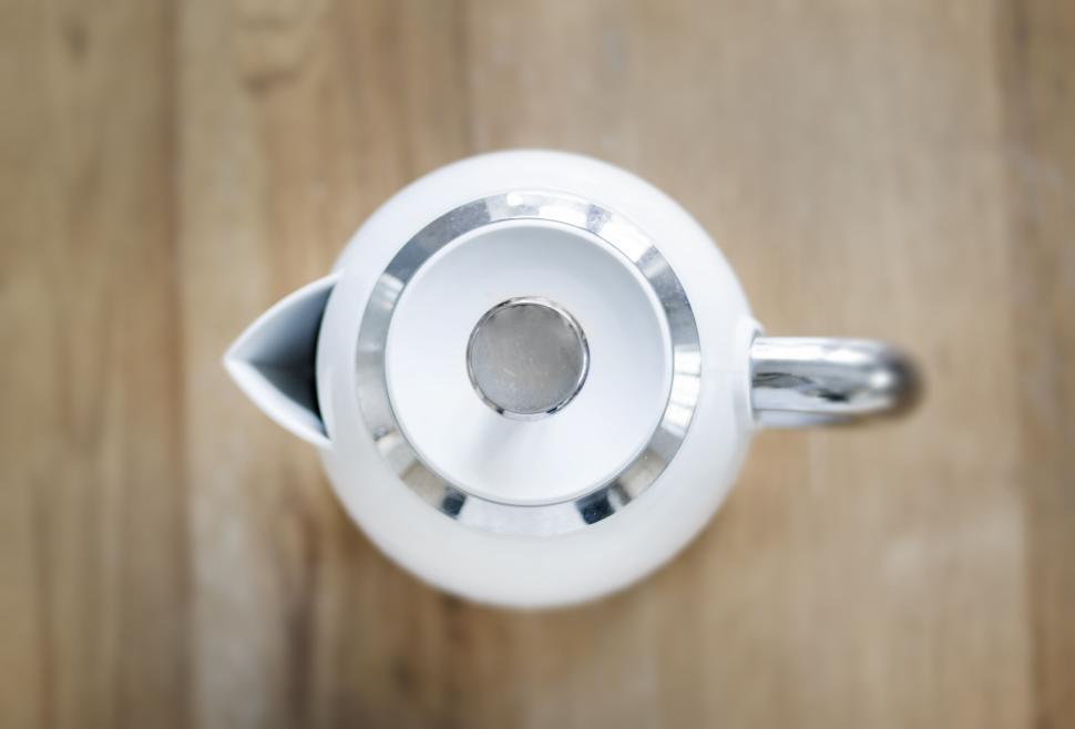 Free Image of Top view of sleek white kettle with silver accents 