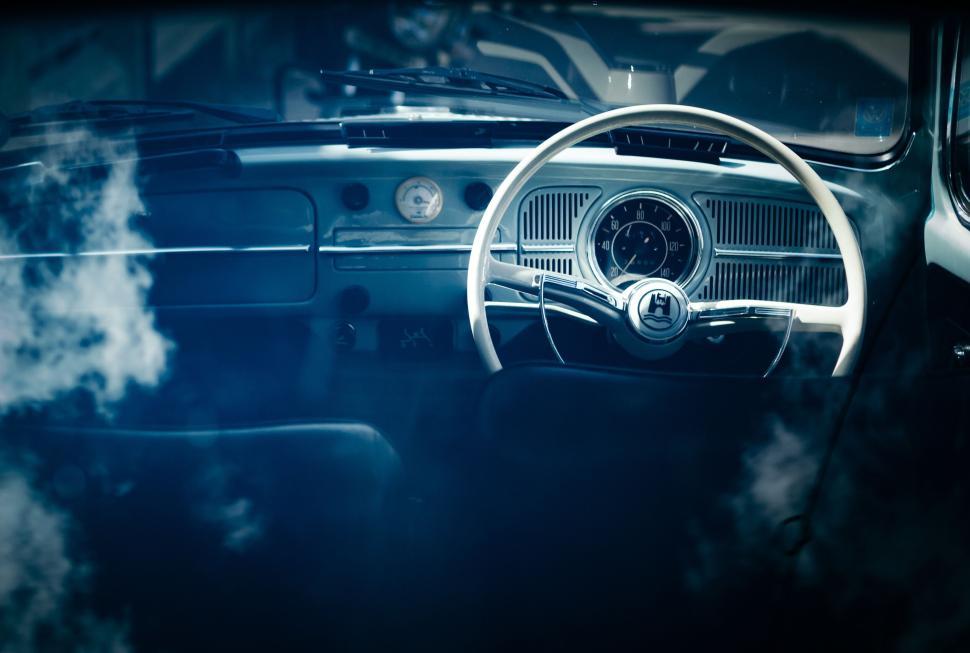 Free Image of Vintage car interior with a classic dashboard and wheel. 