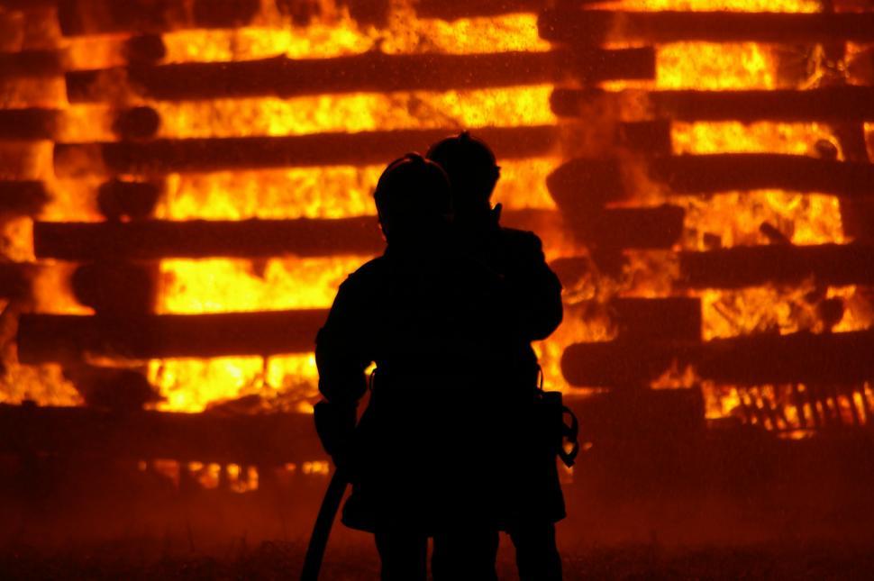 Free Image of Person Standing in Front of Fire 
