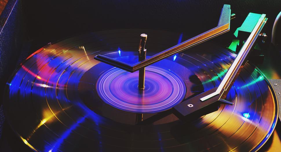 Free Image of Colorful vinyl record spinning on a modern turntable. 
