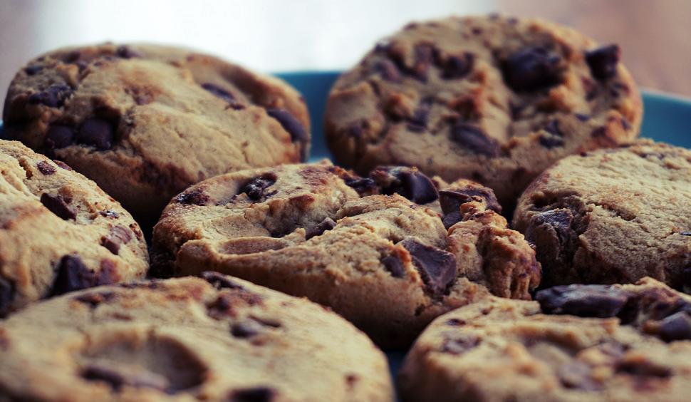 Free Image of Pile of freshly baked chocolate chip cookies close-up. 