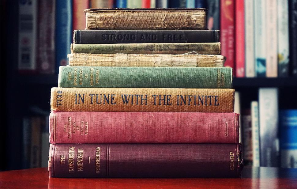 Free Image of Stack of vintage books with interesting titles to read. 