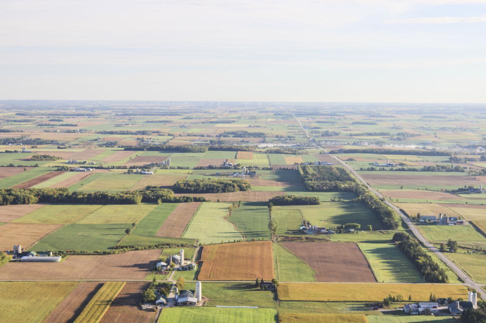 Free Image of Aerial view of the expansive agricultural fields. 