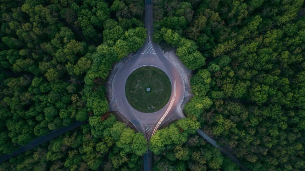 Free Image of Aerial view of forest roundabout with surrounding trees 