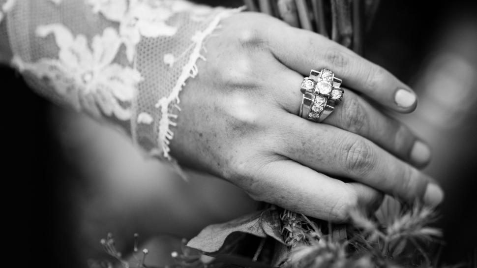 Free Image of Close-up of a bride s hand with a wedding ring bouquet. 