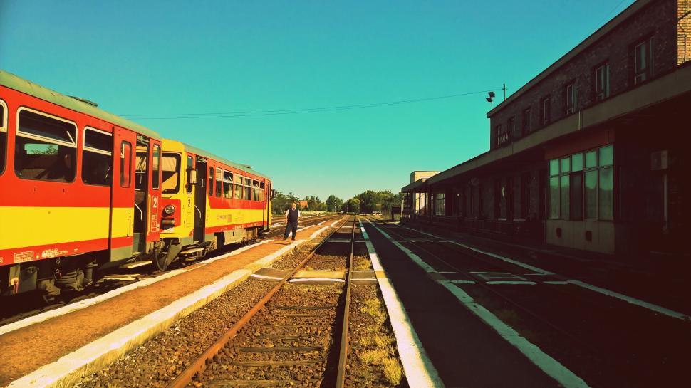 Free Image of Colorful train at station with blue sky background. 