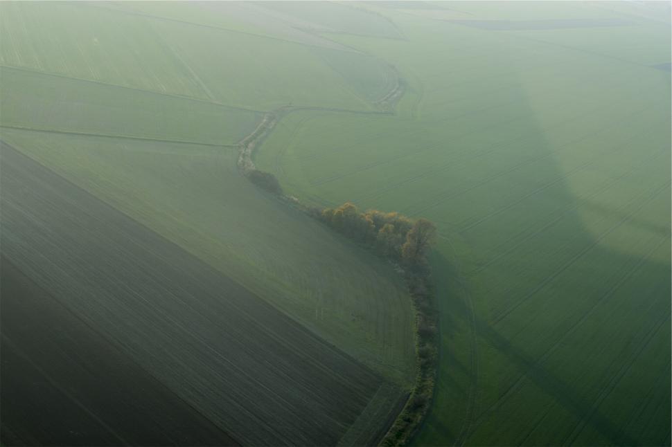 Free Image of Vast green agricultural fields from an aerial view. 