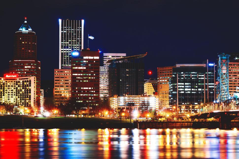 Free Image of Night city skyline with colorful reflections water 