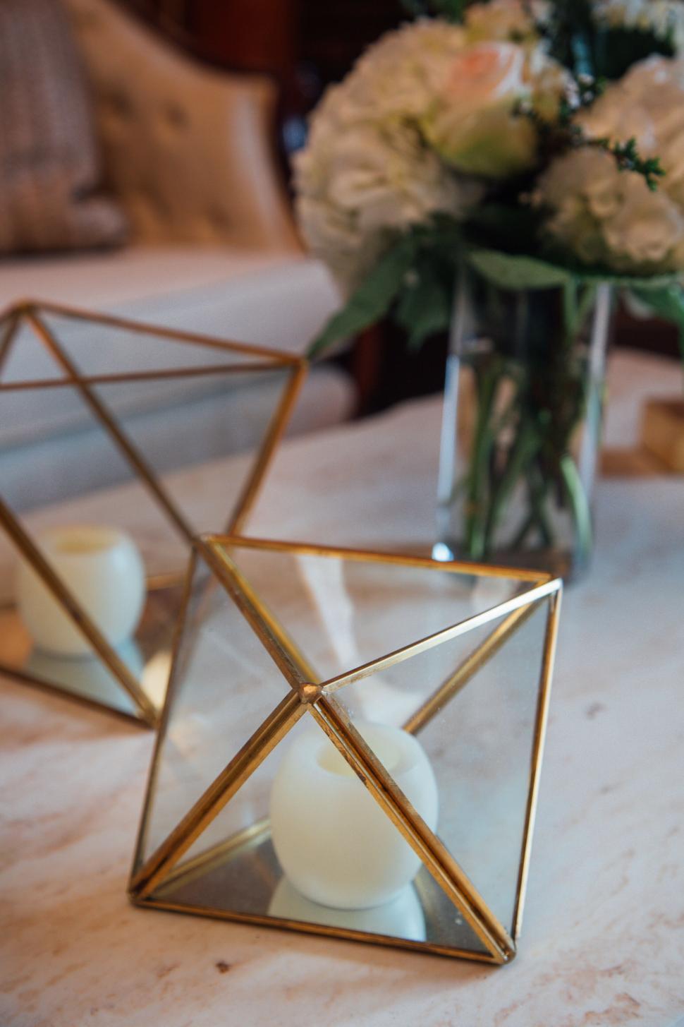 Free Image of Geometric candle holders with white candles inside. 