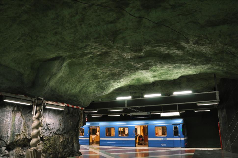 Free Image of Blue train in underground subway station cave walls 