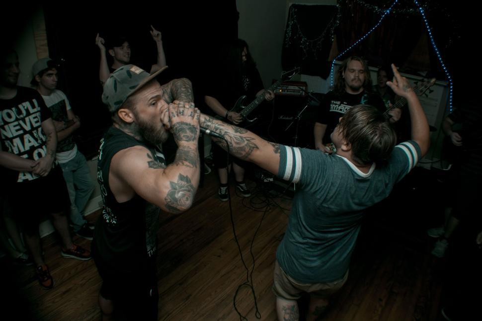 Free Image of Energetic band performance with crowd interaction 