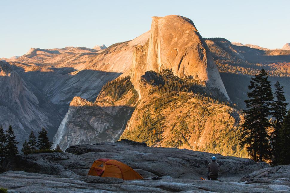 Free Image of Camping with mountain view and rock formation scenery. 