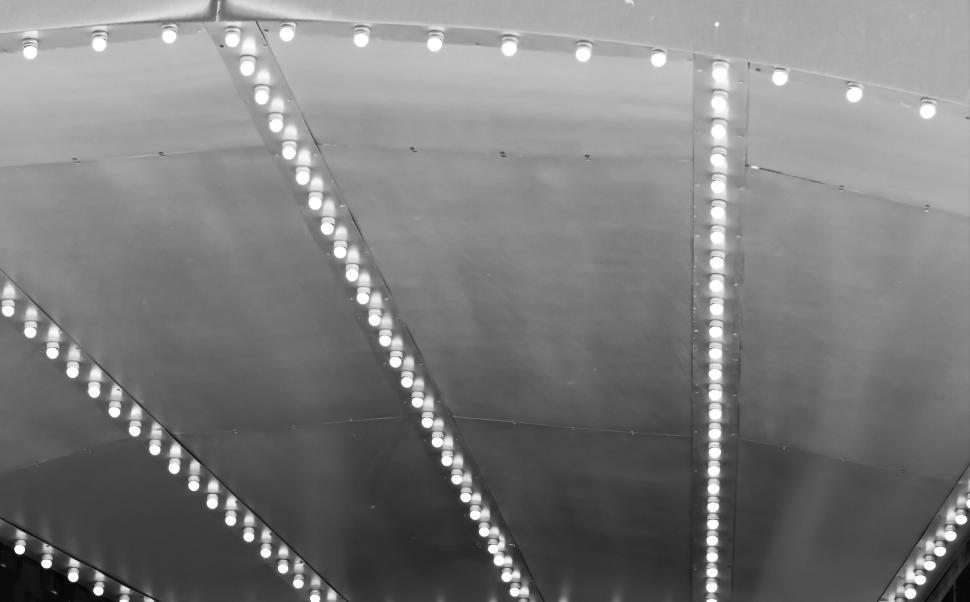 Free Image of Illuminated ceiling with rows of bright lights at night. 