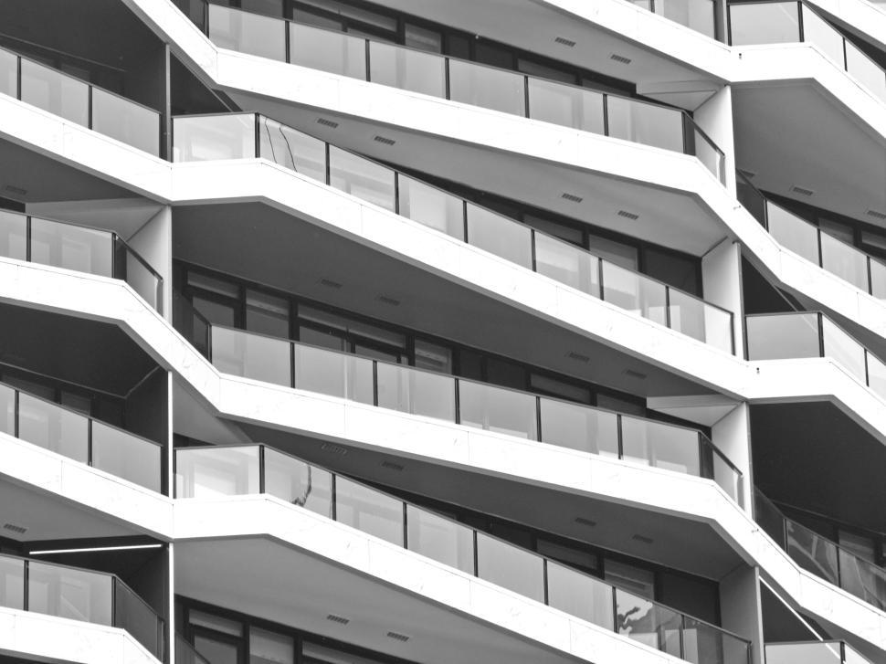 Free Image of Modern apartment building with overlapping balconies 