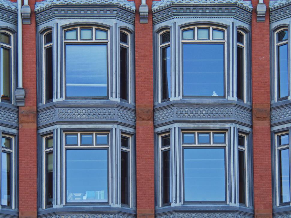 Free Image of Historic building facade with classic windows and brickwork 