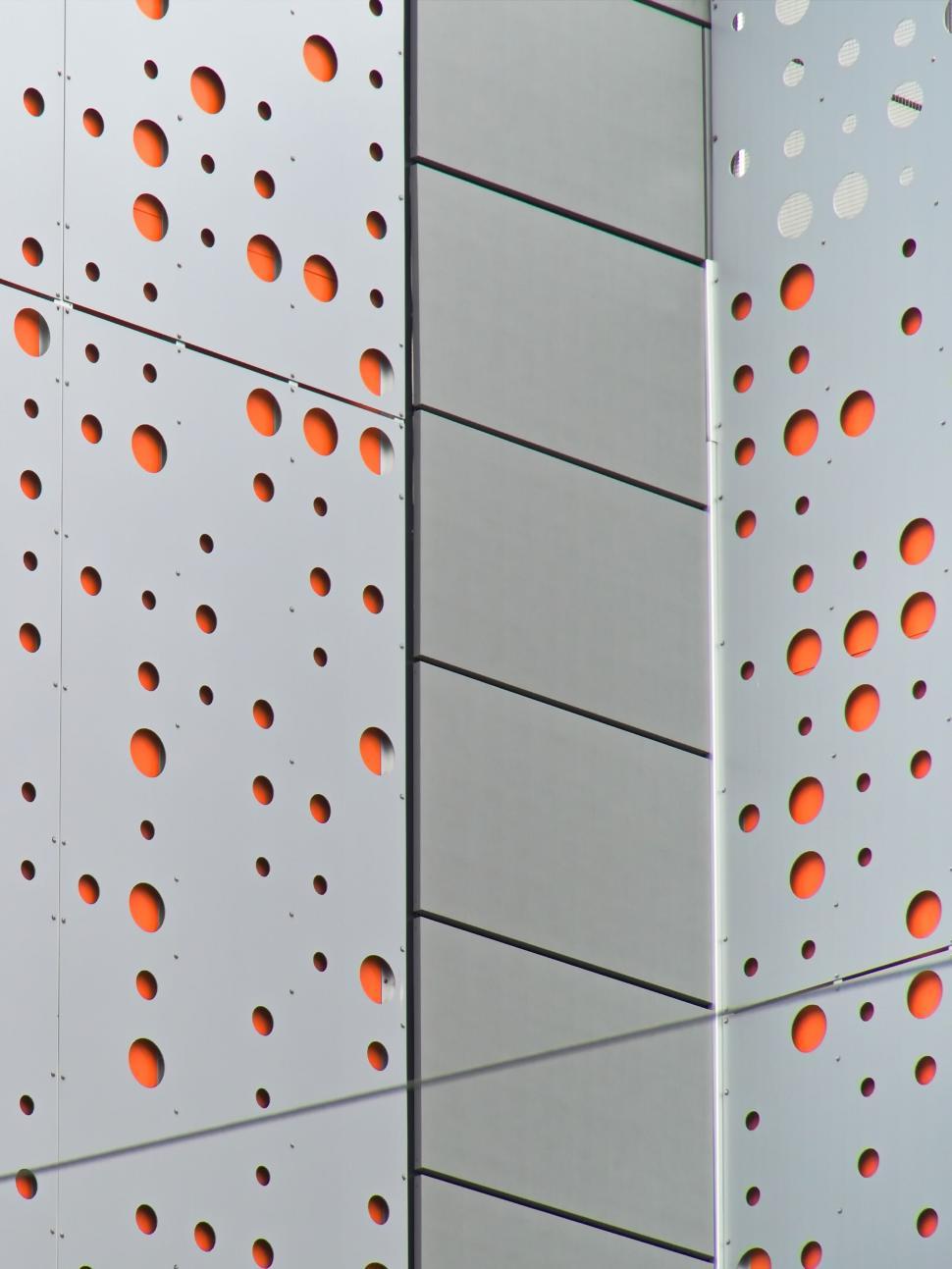 Free Image of Abstract building façade with perforated metal design 