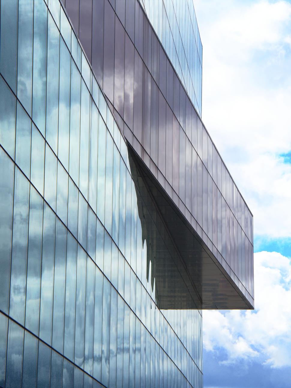 Free Image of Reflective Glass Wall Extending Into The Sky 