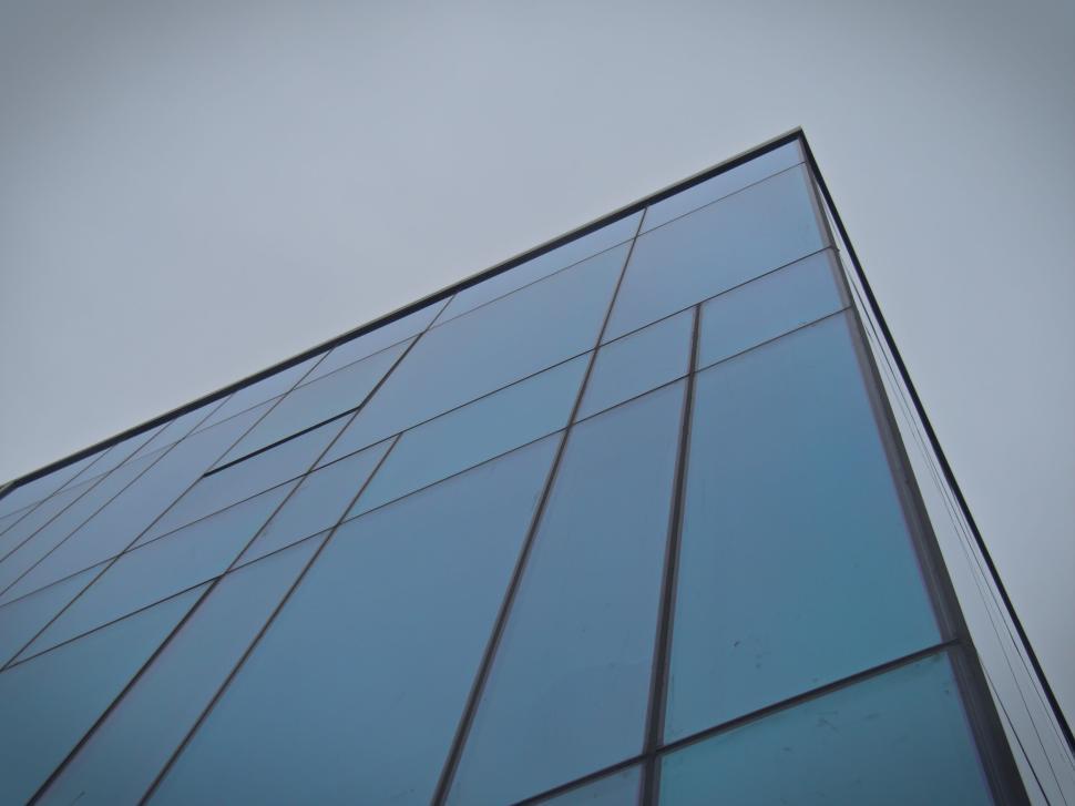 Free Image of Modern Building With Blue Glass Panels And Angled View 