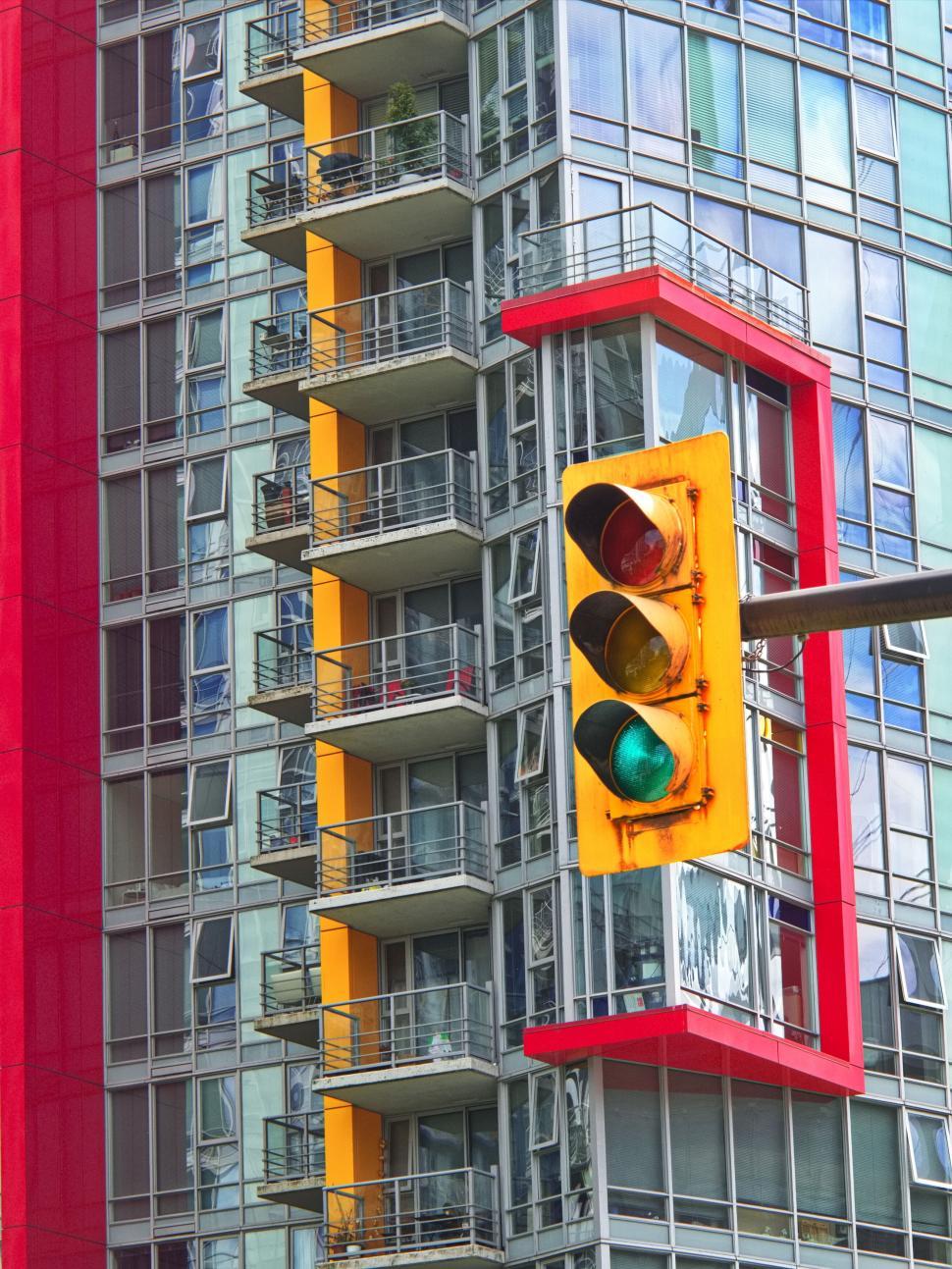 Free Image of Vibrant urban building with multi-colored sections and windows 