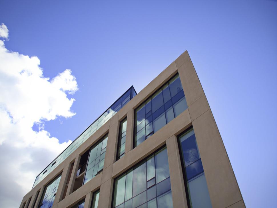 Free Image of Modern architectural building against blue sky view. 