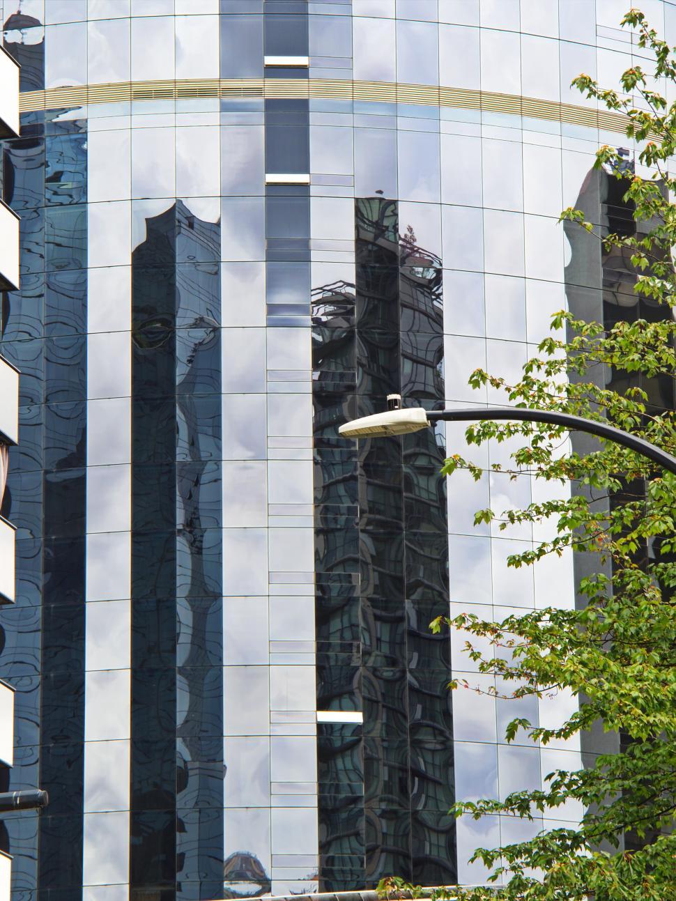 Free Image of Reflective glass facade of modern skyscraper view. 