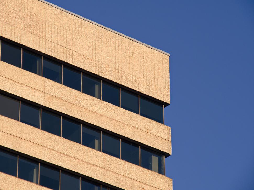 Free Image of High-angle view of a tan-colored building exterior. 
