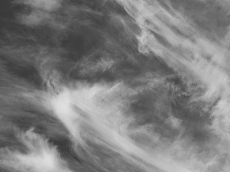 Free Image of Black and white photograph of dramatic cloud formations. 