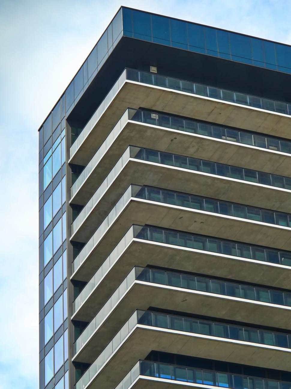 Free Image of High-rise building with prominent balconies and skyline. 