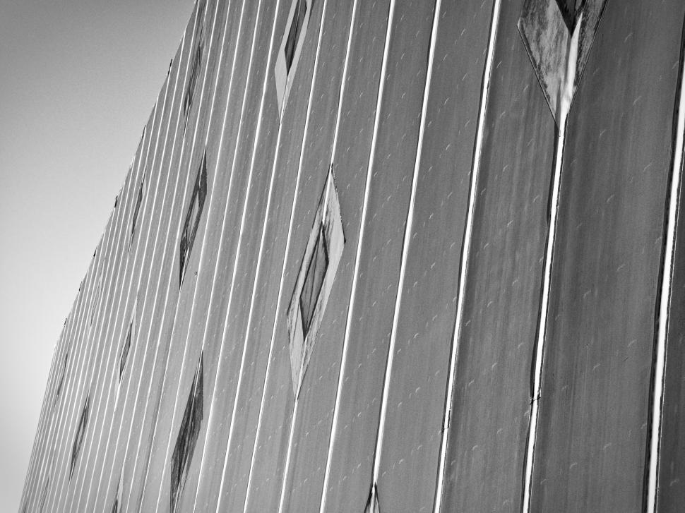 Free Image of Modern structural wall with scattered windows angles 