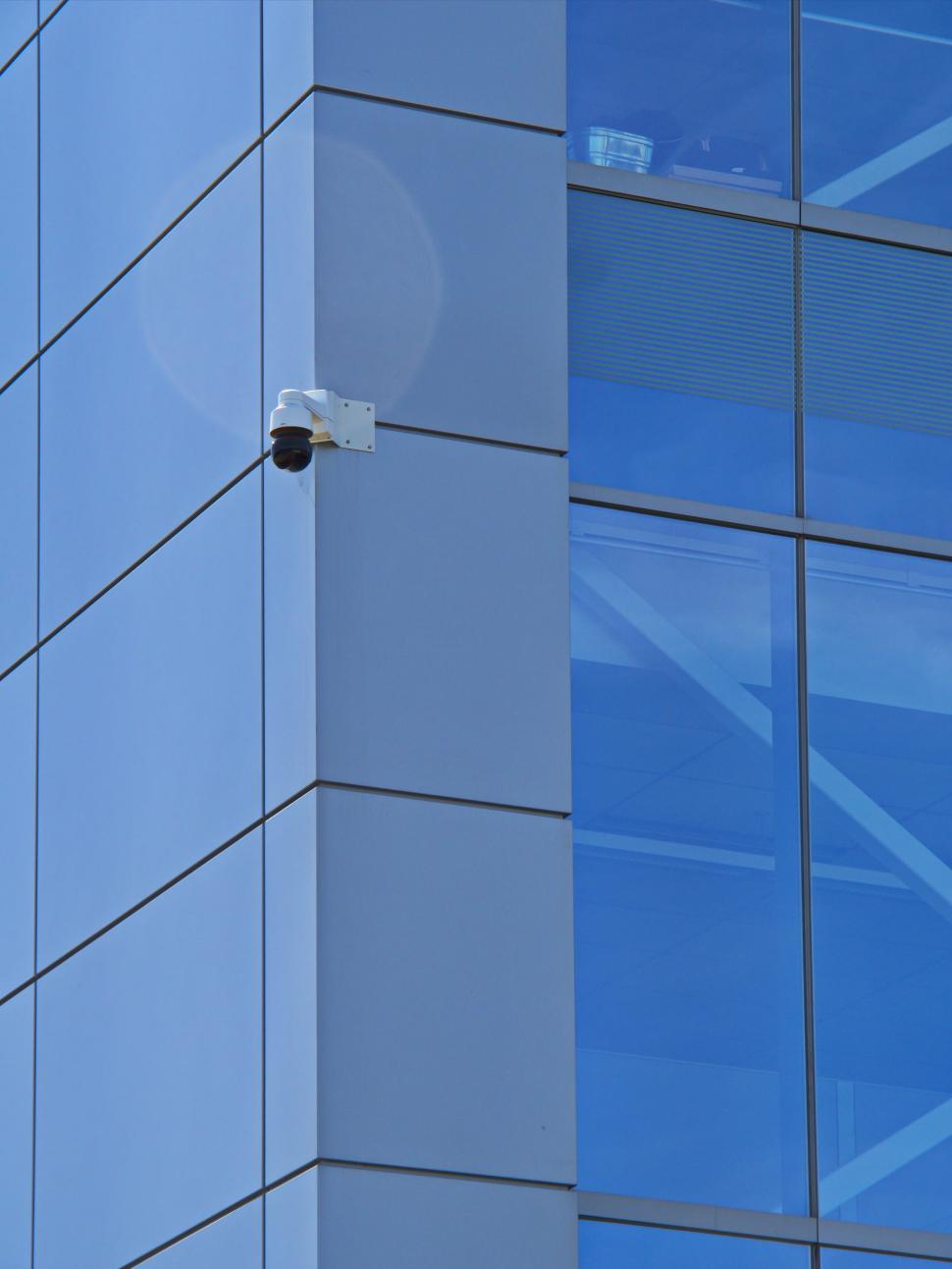Free Image of Sleek modern building with security camera visible 