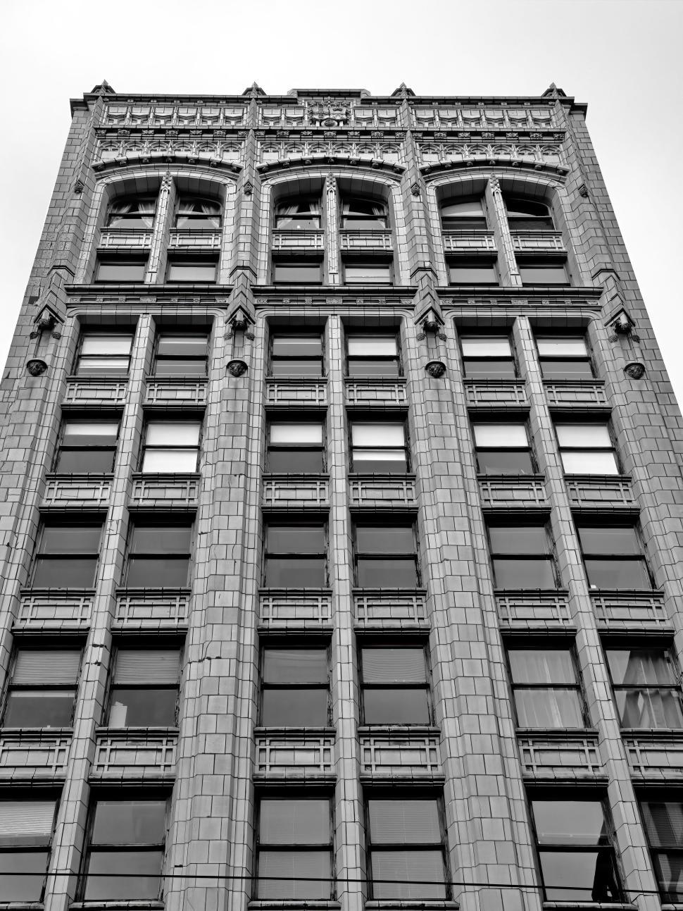 Free Image of Historic stone building façade with detailed artwork 