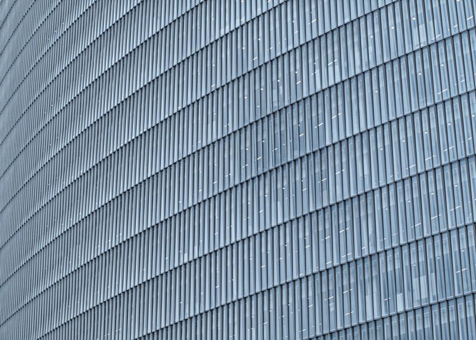 Free Image of Curved facade with repetitive patterns of windows, modern 