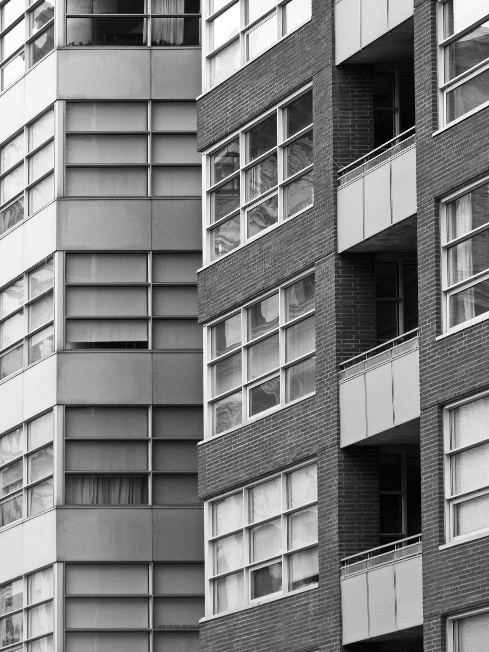 Free Image of Modern apartment building facade with windows and lines. 
