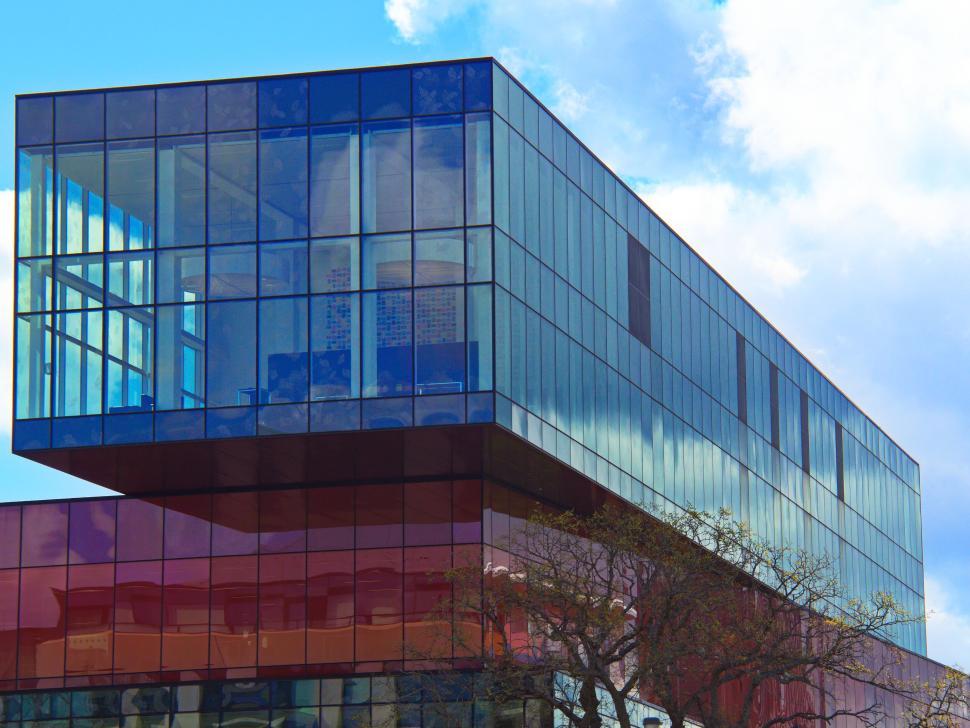 Free Image of Modern glass building with a sky background. 