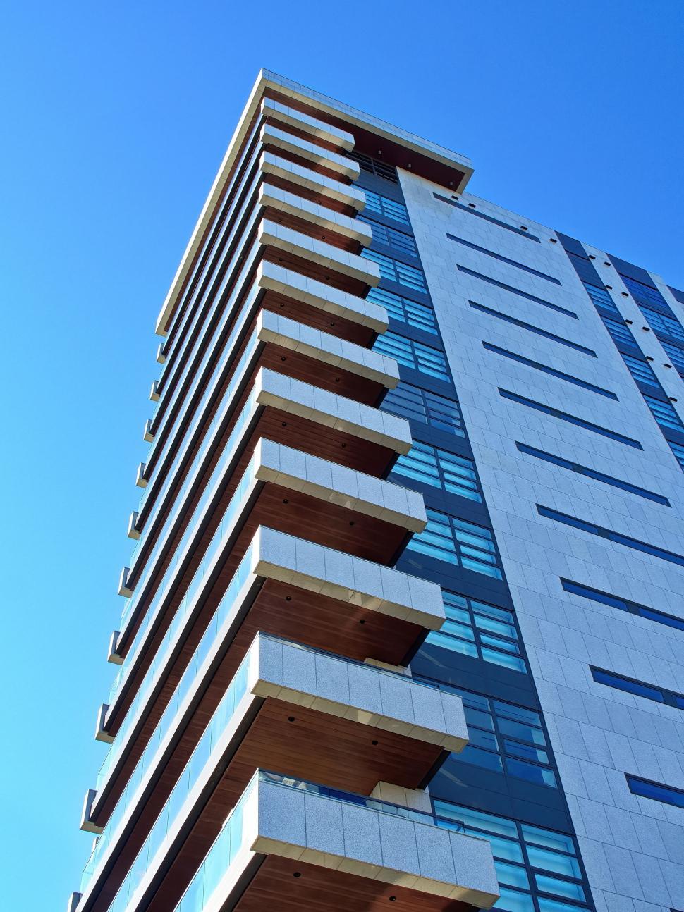 Free Image of Tall modern skyscraper with protruding balconies 