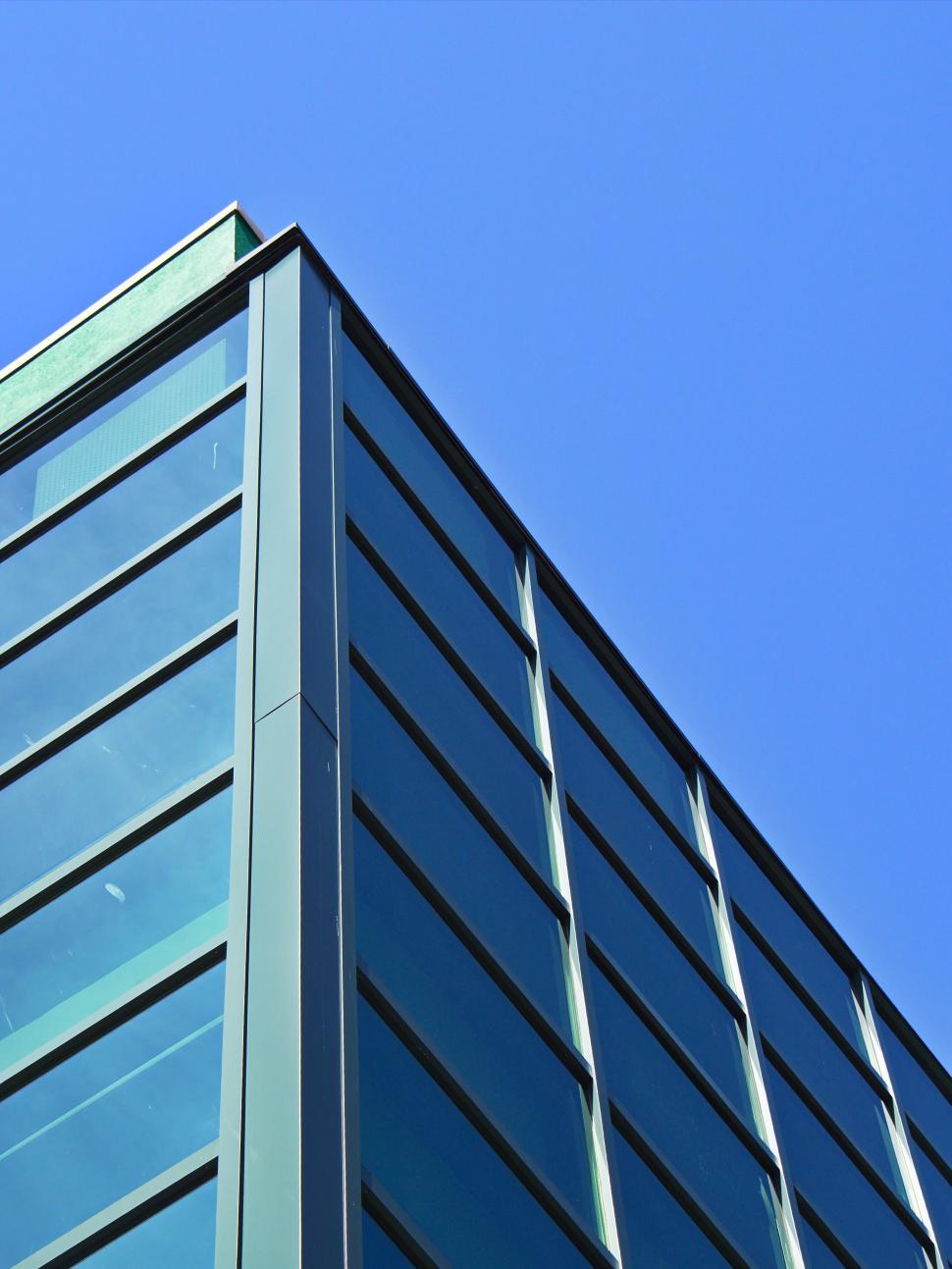 Free Image of Modern building with clear blue sky background view 